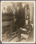 Julian Eltinge at home reading 