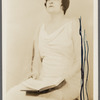 Signed photograph of a seated Angela Morgan with book