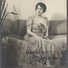 Signed photograph of a seated Angela Morgan in living room