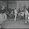 Gilbert Moses [right] and ensemble in rehearsal for the stage production Ain't Supposed to Die a Natural Death