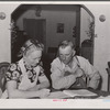 Mr. and Mrs. Fred Maschman going over their record book discuss ways of making their new farm, purchased with FSA (Farm Security Administration) aid, more profitable. Iowa County, Iowa