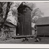 Corncrib and silo on Fred Goecke's farm. Marshall County, Iowa