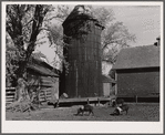 Corncrib and silo on Fred Goecke's farm. Marshall County, Iowa