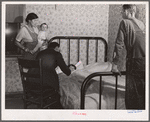 A physician cooperating with FSA (Farm Security Administration) medical health plan visits the home of a rehabilitation client. Saint Charles County, Missouri
