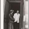 Rehabilitation client after receiving treatment leaves office of dentist participating in FSA (Farm Security Administration) health program. Saint Charles County, Missouri