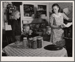 Mrs. Dixon cans an adequate supply of fruits and vegetables to give her family a balanced diet during the winter. Saint Charles County, Missouri
