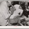 Dentist participating in FSA (Farm Security Administration) health program treats rehabilitation client. Saint Charles County, Missouri