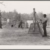 Evicted sharecropper at well. Butler County, Missouri