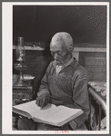 Evicted sharecropper reading the Bible. Butler County, Missouri