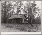 Evicted sharecroppers building a cabin. Butler County, Missouri