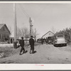 Farmers going to auction at P.C. Zimmerman farm near Hastings, Nebraska