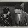 Laura La Plante and Edward Everett Horton (in bowler hat) and  in the motion picture Poker Faces