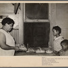 Wife of steel worker with bread she has baked. Midland, Pennsylvania
