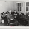 Workmen from Mare Island navy yard in the community room at the FSA (Farm Security Administration) defense housing dormitories. Vallejo, California
