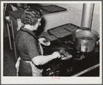 Woodville, California. FSA (Farm Security Administration) farm workers' community. The women's club sells hamburgers at the Saturday night dances