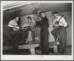 Woodville, California. FSA (Farm Security Administration) farm workers' community. Musicians at the Saturday night dance