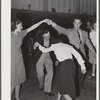 Woodville, California. FSA (Farm Security Administration) farm workers' community. Square dance at the Saturday night dance