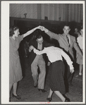 Woodville, California. FSA (Farm Security Administration) farm workers' community. Square dance at the Saturday night dance