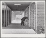 Woodville, California. FSA (Farm Security Administration) farm workers' community. Outside passageways are used wherever possible in the community building
