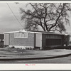 Woodville, California. FSA (Farm Security Administration) farm workers' community. Row of metal shelters