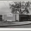 Woodville, California. FSA (Farm Security Administration) farm workers' community. Row of metal shelters