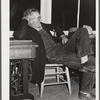 Woodville, California. FSA (Farm Security Administration) farm workers' community. Camper attends the camp council meeting