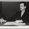 Tulare County, California. FSA (Farm Security Administration) farm workers' camp. Secretary-treasurer of the cooperative store