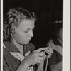 Girl scout learning to knit.  FSA Farm Workers Camp, Tulare County, California