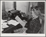 Tulare County, California. FSA (Farm Security Administration) farm workers' camp. Getting out the camp paper