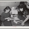 Tulare County, California. FSA (Farm Security Administration) farm workers' camp. Counting up the proceeds from the President's birthday ball