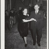 Tulare County, California. FSA (Farm Security Administration) farm workers' camp. Agricultural workers dance at the President's birthday ball