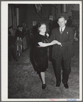 Tulare County, California. FSA (Farm Security Administration) farm workers' camp. Agricultural workers dance at the President's birthday ball