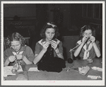 Tulare County, California. FSA (Farm Security Administration) farm workers' camp. Girl scouts learning to knit