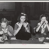 Tulare County, California. FSA (Farm Security Administration) farm workers' camp. Girl scouts learning to knit