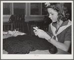 Tulare County, California. FSA (Farm Security Administration) farm workers' camp. Girl Scout knitting