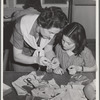 Tulare County, California. FSA (Farm Security Administration) farm workers' camp. Girl Scouts learning to sew
