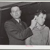 Woodville, California. FSA (Farm Security Administration) farm workers' community. Doctor pointing out "pressure spot" to stop arterial bleeding at the first aid class