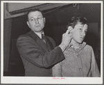Woodville, California. FSA (Farm Security Administration) farm workers' community. Doctor pointing out "pressure spot" to stop arterial bleeding at the first aid class