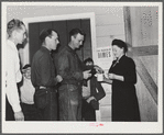 Tulare County, California. FSA (Farm Security Administration) farm workers' camp. Agricultural workers contributing their dimes at the President's birthday ball