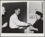 Tulare County, California. FSA (Farm Security Administration) farm workers' camp. Agricultural worker contributing his dime at the President's birthday ball