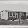 House and son of permanent agricultural worker living at the FSA Farm Workers Community, Woodville, California