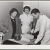 Woodville, California. FSA (Farm Security Administration) farm workers' community. Doctor examining child of agricultural workers at the clinic