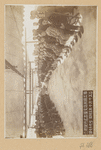 Two groups of seated people, facing each other, in unidentified building in Japan