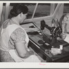 Woodville, California. FSA (Farm Security Administration) farm workers' community. The sewing room for agricultural workers