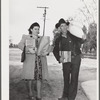 Tulare County, California. Tenant purchase clients' cooperative store. Farmer and his wife bringing groceries from the store
