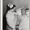 Eleven Mile Corner, Arizona. Cairns General Hospital. FSA (Farm Security Administration) farm workers' community. Nurse taking temperature of a patient