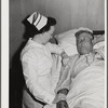 Eleven Mile Corner, Arizona. Cairns General Hospital. FSA (Farm Security Administration) farm workers' community. Nurse taking temperature of a patient