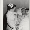 Eleven Mile Corner, Arizona. Cairns General Hospital. FSA (Farm Security Administration) farm workers' community. Nurse taking temperature of a patient