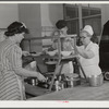 Eleven Mile Corner, Arizona. Cairns General Hospital. FSA (Farm Security Administration) farm workers' community. Preparing lunch. NYA (National Youth Administration) girls help in kitchen