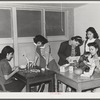 NYA (National Youth Administration) girls who live at the resident center at the FSA (Farm Security Administration) farm workers' community at Eleven Mile Corner, Arizona, learn to use waste materials for toys, jewelry, etc